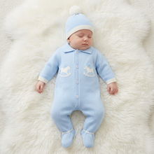 Load image into Gallery viewer, Sleeping baby in blue on a white fluffy rug