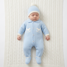 Load image into Gallery viewer, Sleeping baby in blue on a white knitted blanket