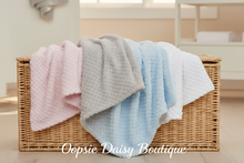 Load image into Gallery viewer, Textured baby blankets including white draped over baskets