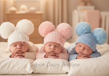 Load image into Gallery viewer, Three babies on pillows with pom-pom hats