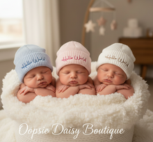 Load image into Gallery viewer, Three babies with Hello World hats sitting