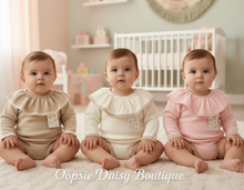 Load image into Gallery viewer, Three baby girls in beige, cream, and pink rompers