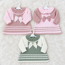 Load image into Gallery viewer, Three knitted dress sets on a white fluffy rug
