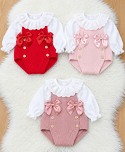 Load image into Gallery viewer, Three romper outfits laid out on a sheepskin rug, two on top and one below