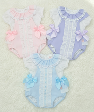 Load image into Gallery viewer, Three rompers on white fluffy rug