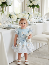 Load image into Gallery viewer, Toddler in party room with white and blue flowers