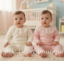 Load image into Gallery viewer, Two baby girls in white and pink knitted outfits