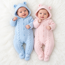 Load image into Gallery viewer, Two smiling babies side by side in the blue and pink cable-knit pramsuits