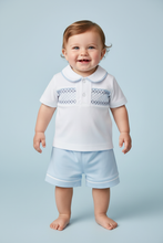 Load image into Gallery viewer, White and blue outfit on boy model - blue bg
