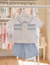 Load image into Gallery viewer, White and blue outfit on rail - sunlit