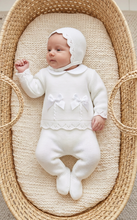 Load image into Gallery viewer, White knitted set with a relaxed newborn pose, overhead basket view