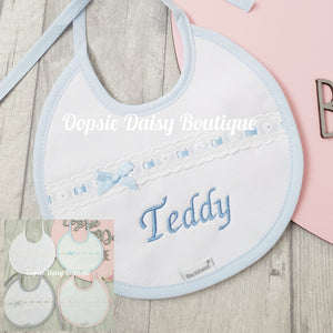 Personalised Spanish Round Bib With Slotted Ribbon Towelling Back